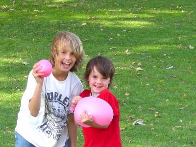 Happy Brothers With Waterballoons